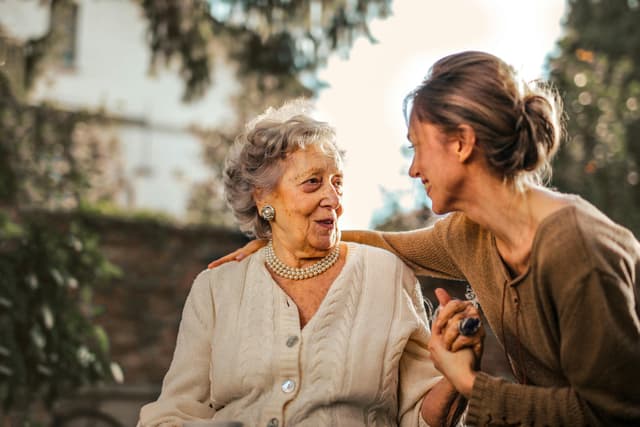 Two women sharing a warm moment together